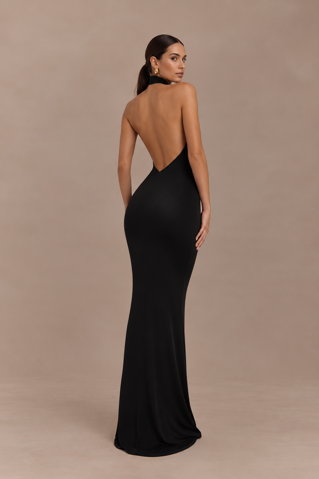 Model wearing classic black lace halter maxi dress, back view
